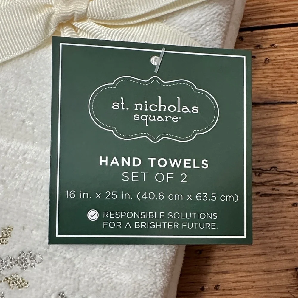 St. Nicholas Square Cream Towels with Silver and Gold Snowflakes